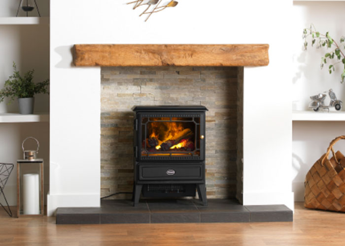 A black Optimyst Dimplex Stove in a fireplace.