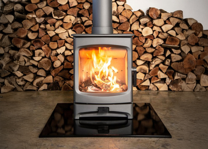 The Charnwood Aire 5 Stove with a fire lit inside.